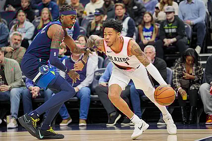 Mar 4, 2024; Minneapolis, Minnesota, USA; Portland Trail Blazers guard Anfernee Simons (1) dribbles against the Minnesota Timberwolves forward Jaden McDaniels (3) in the first quarter at Target Center. Mandatory Credit: Brad Rempel-USA TODAY Sports