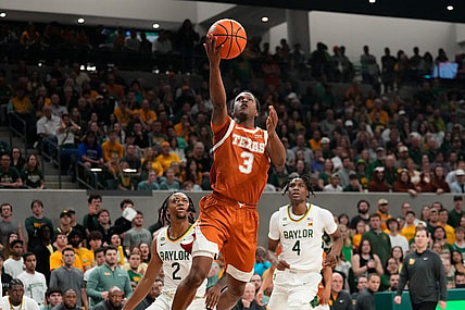 Mar 4, 2024; Waco, Texas, USA;  Texas Longhorns guard Max Abmas (3) scores a layup past Baylor Bears guard Jayden Nunn (2) during the first half at Paul and Alejandra Foster Pavilion. Mandatory Credit: Chris Jones-USA TODAY Sports