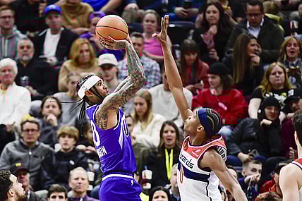 Mar 4, 2024; Salt Lake City, Utah, USA; Utah Jazz guard Jordan Clarkson (00) shoots over Washington Wizards guard Bilal Coulibaly (0) during the first half at the Delta Center. Mandatory Credit: Christopher Creveling-USA TODAY Sports