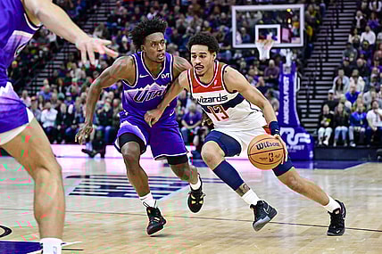Mar 4, 2024; Salt Lake City, Utah, USA; Washington Wizards guard Jordan Poole (13) drives around Utah Jazz guard Collin Sexton (2) during the first half at the Delta Center. Mandatory Credit: Christopher Creveling-USA TODAY Sports