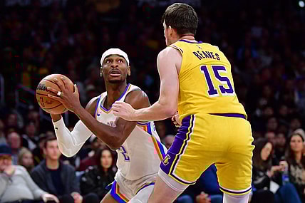 Mar 4, 2024; Los Angeles, California, USA;  Oklahoma City Thunder guard Shai Gilgeous-Alexander (2) controls the ball against Los Angeles Lakers guard Austin Reaves (15) during the second half at Crypto.com Arena. Mandatory Credit: Gary A. Vasquez-USA TODAY Sports