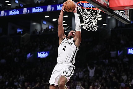 Mar 5, 2024; Brooklyn, New York, USA;  Brooklyn Nets guard Dennis Smith Jr. (4) goes up for a dunk in the fourth quarter against the Philadelphia 76ers at Barclays Center. Mandatory Credit: Wendell Cruz-USA TODAY Sports
