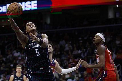 Mar 6, 2024; Washington, District of Columbia, USA; Orlando Magic forward Paolo Banchero (5) shoots the ball as Washington Wizards guard Bilal Coulibaly (0) looks on in the first half at Capital One Arena. Mandatory Credit: Geoff Burke-USA TODAY Sports