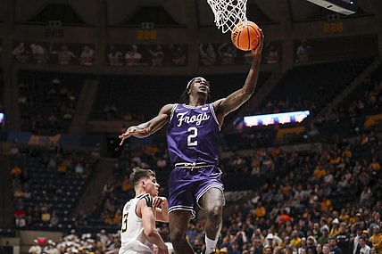 Mar 6, 2024; Morgantown, West Virginia, USA; TCU Horned Frogs forward Emanuel Miller (2) shoots in the lane during the first half against the West Virginia Mountaineers at WVU Coliseum. Mandatory Credit: Ben Queen-USA TODAY Sports