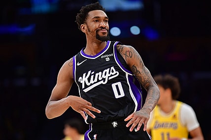 Mar 6, 2024; Los Angeles, California, USA;  Sacramento Kings guard Malik Monk (0) reacts after scoring a three point basket against the against the Los Angeles Lakers during the second half at Crypto.com Arena. Mandatory Credit: Gary A. Vasquez-USA TODAY Sports