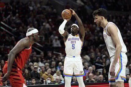 Mar 6, 2024; Portland, Oregon, USA; Oklahoma City Thunder guard Luguentz Dort (5) shoots the ball during the second half against the Portland Trail Blazers at Moda Center. Mandatory Credit: Soobum Im-USA TODAY Sports