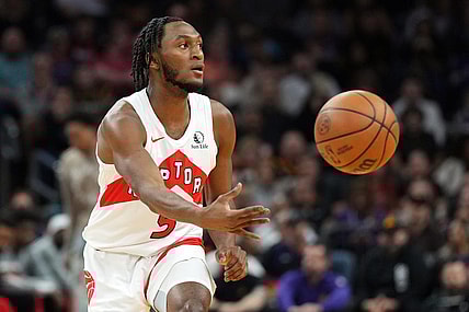 Mar 7, 2024; Phoenix, Arizona, USA; Toronto Raptors guard Immanuel Quickley (5) passes against the Phoenix Suns during the first half at Footprint Center. Mandatory Credit: Joe Camporeale-USA TODAY Sports