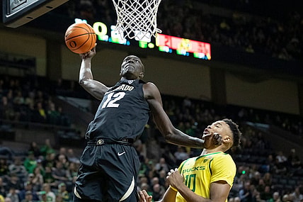 Colorado forward Bangot dunks the ball as the Oregon Ducks host the Colorado Buffaloes Thursday, March 7, 2024 at Matthew Knight Arena in Eugene, Ore.