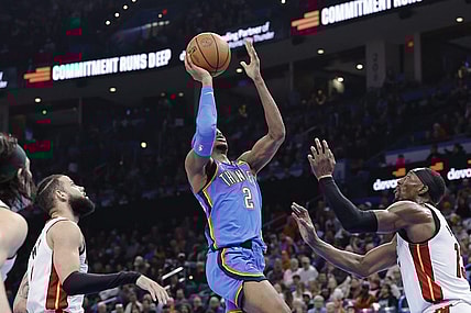 Mar 8, 2024; Oklahoma City, Oklahoma, USA; Oklahoma City Thunder guard Shai Gilgeous-Alexander (2) shoots in front of Miami Heat center Bam Adebayo (13) during the second half at Paycom Center. Mandatory Credit: Alonzo Adams-USA TODAY Sports