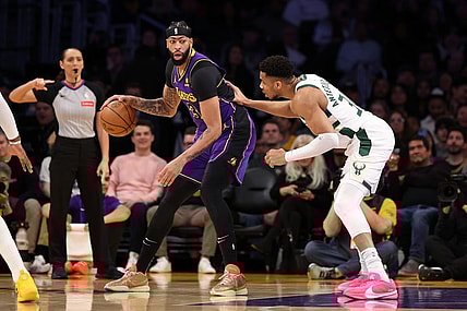 Mar 8, 2024; Los Angeles, California, USA;  Los Angeles Lakers forward Anthony Davis (3) posts up against Milwaukee Bucks forward Giannis Antetokounmpo (34) during the first quarter at Crypto.com Arena. Mandatory Credit: Kiyoshi Mio-USA TODAY Sports