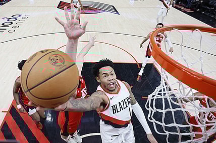 Mar 8, 2024; Portland, Oregon, USA; Portland Trail Blazers shooting guard Anfernee Simons (1) shoots the ball past Houston Rockets center Alperen Sengun (28) during the second half at Moda Center. Mandatory Credit: Soobum Im-USA TODAY Sports