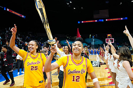 Mar 8, 2024; Las Vegas, NV, USA; USC Trojans guard JuJu Watkins (12) celebrates with USC Trojans guard McKenzie Forbes (25) after the Trojans defeated the UCLA Bruins 80-70 in double overtime at MGM Grand Garden Arena. Mandatory Credit: Stephen R. Sylvanie-USA TODAY Sports