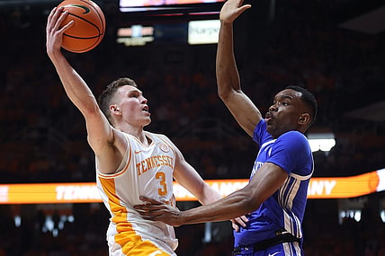 Mar 9, 2024; Knoxville, Tennessee, USA; Tennessee Volunteers guard Dalton Knecht (3) goes to the basket against Kentucky Wildcats forward Ugonna Onyenso (33) during the first half at Thompson-Boling Arena at Food City Center. Mandatory Credit: Randy Sartin-USA TODAY Sports