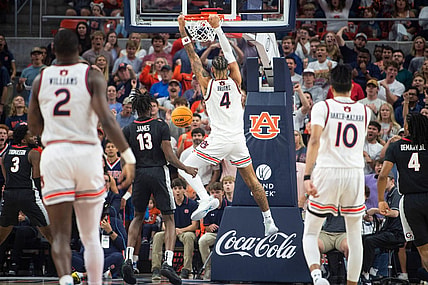 Auburn Tigers forward Johni Broome (4) dunks the ball as Auburn Tigers take on Georgia Bulldogs at Neville Arena in Auburn, Ala., on Saturday, March 9, 2024.
