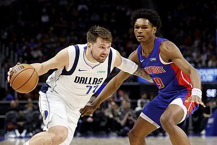 Mar 9, 2024; Detroit, Michigan, USA;  Dallas Mavericks guard Luka Doncic (77) dribbles against Detroit Pistons forward Ausar Thompson (9) in the first half at Little Caesars Arena. Mandatory Credit: Rick Osentoski-USA TODAY Sports
