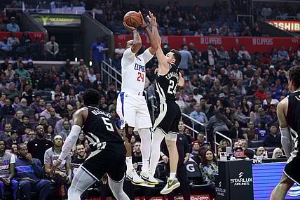 Mar 10, 2024; Los Angeles, California, USA;  Los Angeles Clippers guard Norman Powell (24) shoots the ball over Milwaukee Bucks guard Pat Connaughton (24) during the first quarter at Crypto.com Arena. Mandatory Credit: Kiyoshi Mio-USA TODAY Sports