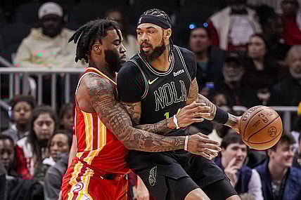 Mar 10, 2024; Atlanta, Georgia, USA; New Orleans Pelicans forward Brandon Ingram (14) dribbles guarded by Atlanta Hawks forward Saddiq Bey (41) during the first half at State Farm Arena. Mandatory Credit: Dale Zanine-USA TODAY Sports