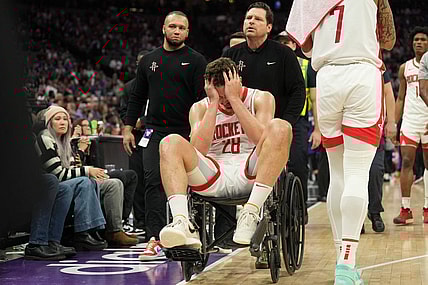 Mar 10, 2024; Sacramento, California, USA; Houston Rockets center Alperen Sengun (28) is wheeled off of the court after suffering an injury against the Sacramento Kings during the fourth quarter at Golden 1 Center. Mandatory Credit: Darren Yamashita-USA TODAY Sports