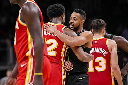 Mar 10, 2024; Atlanta, Georgia, USA; Atlanta Hawks forward De'Andre Hunter (12) and New Orleans Pelicans guard CJ McCollum (3) react together after the game at State Farm Arena. Mandatory Credit: Dale Zanine-USA TODAY Sports