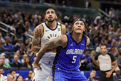 Mar 10, 2024; Orlando, Florida, USA; Orlando Magic forward Paolo Banchero (5) and Indiana Pacers forward Obi Toppin (1) look for the rebound during the second half at KIA Center. Mandatory Credit: Mike Watters-USA TODAY Sports