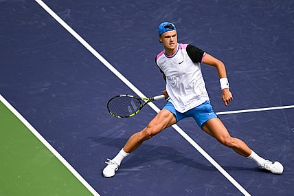 Mar 11, 2024; Indian Wells, CA, USA; Holger Rune (DEN) hits a shot in his third round match against Lorenzo Musetti (ITA) during the BNP Paribas Open at Indian Wells Tennis Garden. Mandatory Credit: Jonathan Hui-USA TODAY Sports