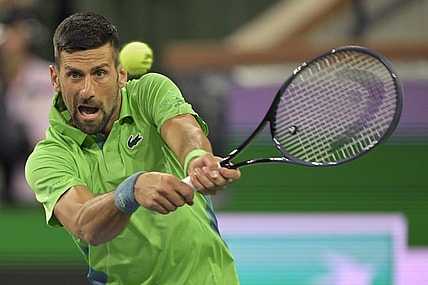 Mar 11, 2024; Indian Wells, CA, USA;  Novak Djokovic (SRB) hits a shot in his third round match against Luca Nardi (ITA) in the BNP Paribas Open at the Indian Wells Tennis Garden. Mandatory Credit: Jayne Kamin-Oncea-USA TODAY Sports