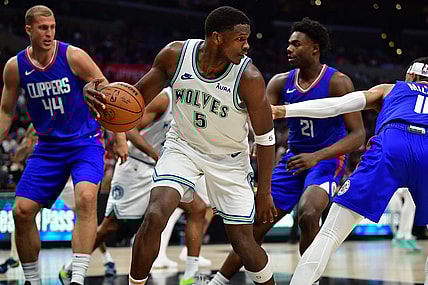 Mar 12, 2024; Los Angeles, California, USA; Minnesota Timberwolves guard Anthony Edwards (5) controls the ball against the Los Angeles Clippers during the second half at Crypto.com Arena. Mandatory Credit: Gary A. Vasquez-USA TODAY Sports
