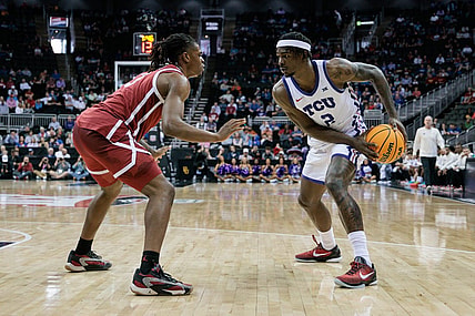 Mar 13, 2024; Kansas City, MO, USA; Oklahoma Sooners guard Otega Oweh (3) guards TCU Horned Frogs forward Emanuel Miller (2) during the first half at T-Mobile Center. Mandatory Credit: William Purnell-USA TODAY Sports