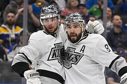 Mar 13, 2024; St. Louis, Missouri, USA;  Los Angeles Kings right wing Adrian Kempe (9) celebrates with defenseman Drew Doughty (8) after scoring against the St. Louis Blues during the third period at Enterprise Center. Mandatory Credit: Jeff Curry-USA TODAY Sports