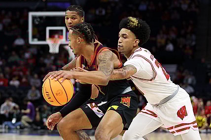 Mar 14, 2024; Minneapolis, MN, USA; Maryland Terrapins guard Jahmir Young (1) dribbles as Wisconsin Badgers guard Chucky Hepburn (23) defends during the first half at Target Center. Mandatory Credit: Matt Krohn-USA TODAY Sports