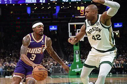 Mar 14, 2024; Boston, Massachusetts, USA;  Phoenix Suns guard Bradley Beal (3) controls the ball while Boston Celtics center Al Horford (42) defends during the first half at TD Garden. Mandatory Credit: Bob DeChiara-USA TODAY Sports