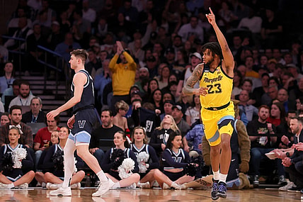Mar 14, 2024; New York City, NY, USA; Marquette Golden Eagles forward David Joplin (23) celebrates his three point shot against Villanova Wildcats guard Brendan Hausen (1) during the first half at Madison Square Garden. Mandatory Credit: Brad Penner-USA TODAY Sports
