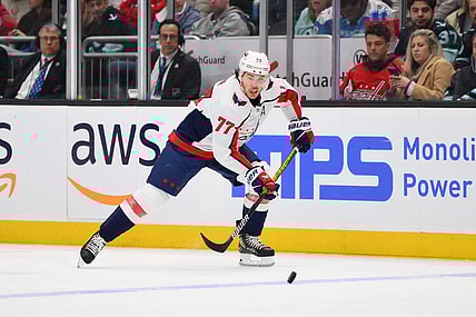 Mar 14, 2024; Seattle, Washington, USA; Washington Capitals right wing T.J. Oshie (77) plays the puck during the third period against the Seattle Kraken at Climate Pledge Arena. Mandatory Credit: Steven Bisig-USA TODAY Sports
