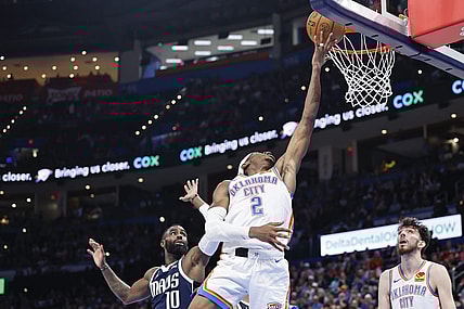 Mar 14, 2024; Oklahoma City, Oklahoma, USA; Oklahoma City Thunder guard Shai Gilgeous-Alexander (2) lays up a shot in front of Dallas Mavericks forward Tim Hardaway Jr. (10) during the second half at Paycom Center. Mandatory Credit: Alonzo Adams-USA TODAY Sports