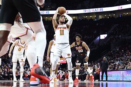 Mar 14, 2024; Portland, Oregon, USA; New York Knicks guard Jalen Brunson (11) shoots a free throw as Portland Trail Blazers guard Scoot Henderson (00) watches in the fourth quarter at Moda Center. Mandatory Credit: Jaime Valdez-USA TODAY Sports