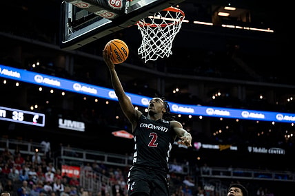 Cincinnati Bearcats guard Jizzle James (2) hits a layup in the second half of the Big 12 Conference tournament game between Cincinnati Bearcats and Baylor Bears at T-Mobile Center in Kansas City, Mo., on Thursday, March 14, 2024.