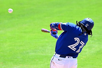 Mar 15, 2024; Dunedin, Florida, USA; Toronto Blue Jays first baseman Vladimir Guerrero Jr. (27) hits a line drive in the third inning of a spring training game against the Detroit Tigers at TD Ballpark. Mandatory Credit: Jonathan Dyer-USA TODAY Sports