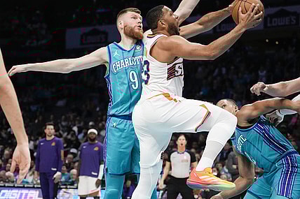Mar 15, 2024; Charlotte, North Carolina, USA; Phoenix Suns guard Eric Gordon (23) drives to the basket against Charlotte Hornets forward Davis Bertans (9) during the first quarter at Spectrum Center. Mandatory Credit: Jim Dedmon-USA TODAY Sports