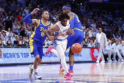 Mar 15, 2024; Washington, D.C., USA; North Carolina Tar Heels guard RJ Davis (4) looses control of the ball as Pittsburgh Panthers guard Jaland Lowe (15) and Panthers forward Blake Hinson (2) defend during the first half at Capital One Arena. Mandatory Credit: Amber Searls-USA TODAY Sports