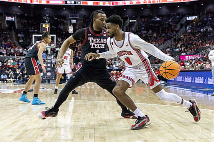 Mar 15, 2024; Kansas City, MO, USA; Houston Cougars guard Mylik Wilson (8) drives around Texas Tech Red Raiders guard Lamar Washington (1) during the first half at T-Mobile Center. Mandatory Credit: William Purnell-USA TODAY Sports