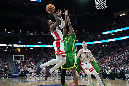 Mar 15, 2024; Las Vegas, NV, USA; Arizona Wildcats guard Caleb Love (2) shoots the ball against Oregon Ducks forward Kwame Evans Jr. (10) in the first half at T-Mobile Arena. Mandatory Credit: Kirby Lee-USA TODAY Sports