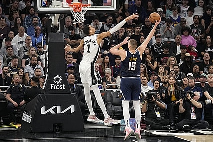 Mar 15, 2024; Austin, Texas, USA; Denver Nuggets center Nikola Jokic (15) shoots over San Antonio Spurs forward Victor Wembanyama (1) during the first half at Moody Center. Mandatory Credit: Scott Wachter-USA TODAY Sports