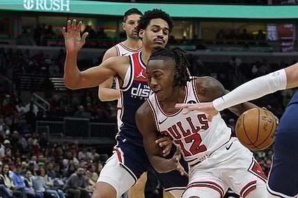 Mar 16, 2024; Chicago, Illinois, USA; Washington Wizards guard Jordan Poole (13) defends Chicago Bulls guard Ayo Dosunmu (12) during the first quarter at United Center. Mandatory Credit: David Banks-USA TODAY Sports
