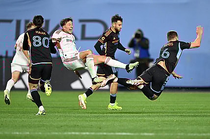 Mar 16, 2024; New York, New York, USA; Toronto FC forward Federico Bernardeschi (10) and New York City FC midfielder James Sands (6) collide during the second half at Yankee Stadium. Mandatory Credit: Mark Smith-USA TODAY Sports