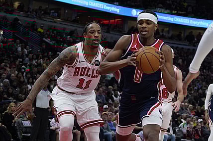 Mar 16, 2024; Chicago, Illinois, USA; Chicago Bulls forward DeMar DeRozan (11) defends Washington Wizards guard Bilal Coulibaly (0) during the second half at United Center. Mandatory Credit: David Banks-USA TODAY Sports