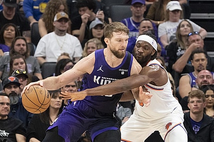 March 16, 2024; Sacramento, California, USA; Sacramento Kings forward Domantas Sabonis (10) dribbles the basketball against New York Knicks forward Precious Achiuwa (5) during the second quarter at Golden 1 Center. Mandatory Credit: Kyle Terada-USA TODAY Sports
