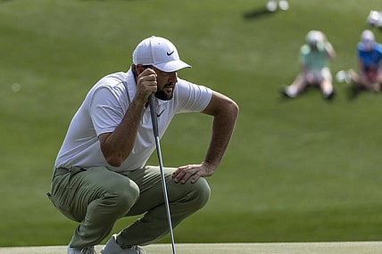 Mar 17, 2024; Ponte Vedra Beach, Florida, USA; Scottie Scheffler lines up a putt on the 3rd green during the final round of THE PLAYERS Championship golf tournament. Mandatory Credit: David Yeazell-USA TODAY Sports