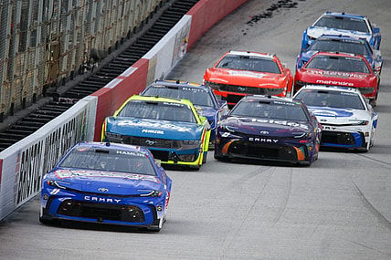 Mar 16, 2024; Bristol, Tennessee, USA; NASCAR Cup Series driver Denny Hamlin (11) leads driver Ryan Blaney (12) during the Food City 500 at Bristol Motor Speedway. Mandatory Credit: Randy Sartin-USA TODAY Sports