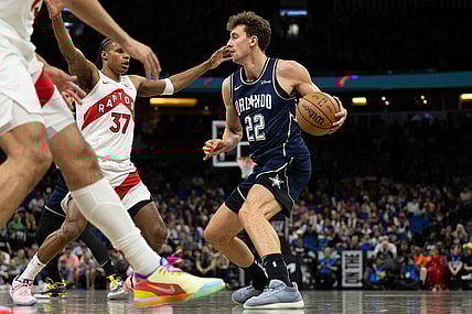 Mar 17, 2024; Orlando, Florida, USA; Orlando Magic forward Franz Wagner (22) dribbles the ball against Toronto Raptors guard Jamie'us Ramsey (37) in the second quarter at KIA Center. Mandatory Credit: Jeremy Reper-USA TODAY Sports