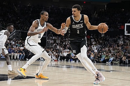 Mar 17, 2024; Austin, Texas, USA; San Antonio Spurs forward Victor Wembanyama (1) drives to the basket while defended by Brooklyn Nets center Nicolas Claxton (33) during the first half at Moody Center. Mandatory Credit: Scott Wachter-USA TODAY Sports